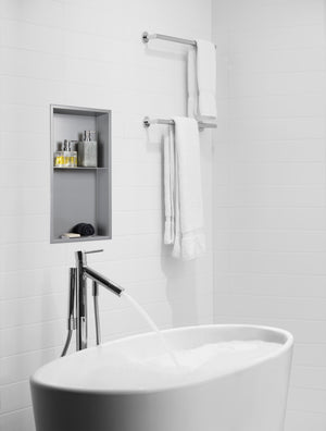 Acia wall niche, 24 × 12 in, matte gray, in a white ceramic wall beside a freestanding tub faucet