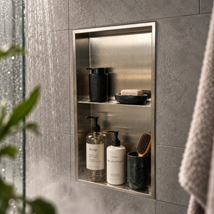 Acia wall niche, 24 × 12 in, brushed stainless steel, recessed in a shower wall, bottles and soap stored inside