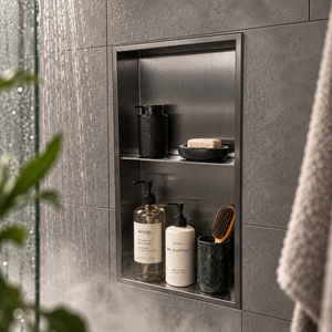 Acia wall niche, 24 × 12 in, black PVD, recessed in a shower wall, bottles and soap stored inside