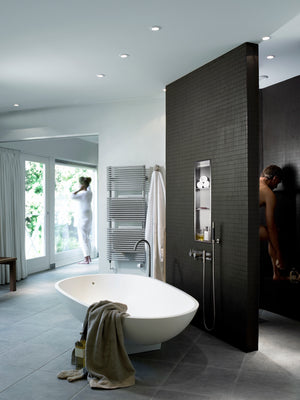 Ana wall niche, 36 × 8 in, brushed stainless steel, in a dark wall near an oval tub and a glass door