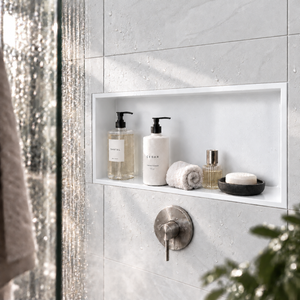 Andy wall niche, 12 × 24 in, matte white, recessed in a shower wall, bottles and soap stored inside