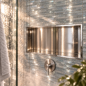 Andy wall niche, 12 × 24 in, mirror finish, recessed in a shower wall, empty