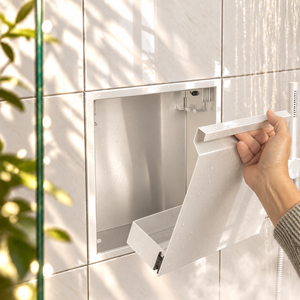 A hand lifts the removable door off the door niche, 12 × 12 in, glossy white