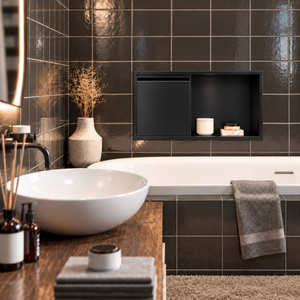 Bathroom with a door niche, 12 × 24 in, matte black, recessed above a bathtub, white vessel sink in the foreground