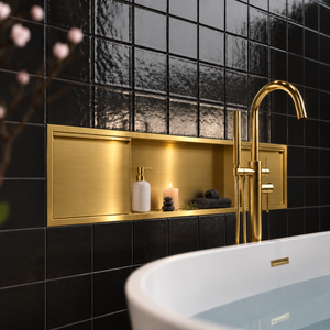 Door niche, 12 × 48 in, gold PVD, door closed, recessed in a bathroom wall