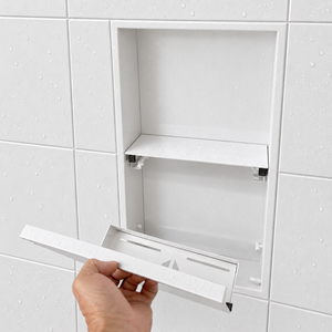 A hand lifts the removable door off the door niche, 24 × 12 in, matte white
