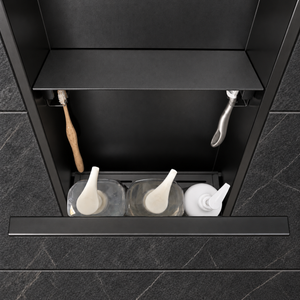 Inside view of the door niche, 24 × 12 in, matte black, door open: bottles stored in the compartment