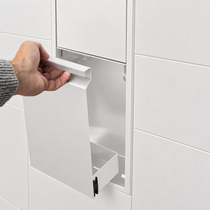 A hand lifts the removable door off the door niche, 36 × 8 in, matte white