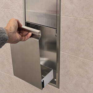 A hand lifts the removable door off the door niche, 36 × 8 in, brushed stainless steel