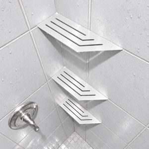 Corner shelf, 4 × 12 in, matte white, in the corner of a tiled shower, two smaller shelves below