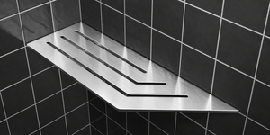Corner shelf, 4 × 12 in, brushed stainless steel, mounted in the corner of a tiled wall