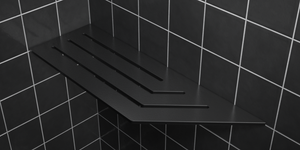 Corner shelf, 4 × 12 in, matte black, mounted in the corner of a tiled wall