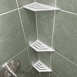 Corner shelf, 4 × 8 in, glossy white, in the corner of a tiled shower, two smaller shelves below