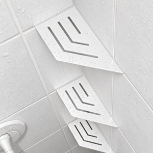 Corner shelf, 4 × 8 in, matte white, angled view, with two more shelves below, in a tiled shower
