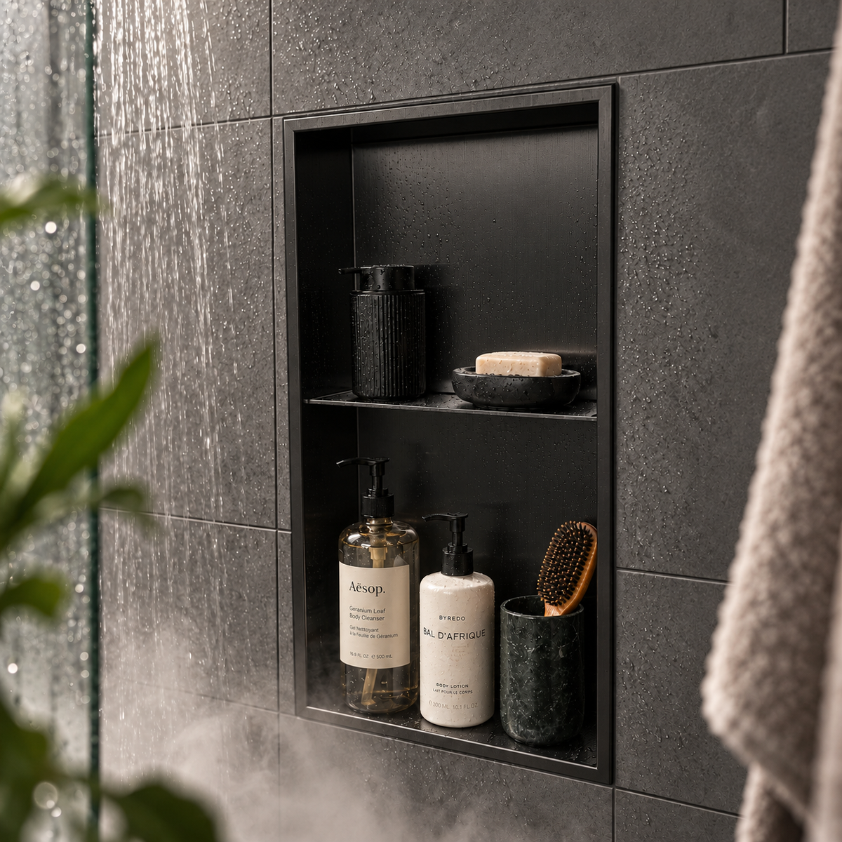 Acia wall niche, 24 × 12 in, matte black, recessed in a shower wall, bottles and soap stored inside