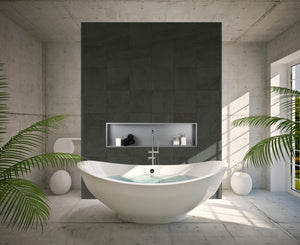 Alba wall niche, 12 × 48 in, matte gray, in a dark tile wall behind an oval tub surrounded by plants