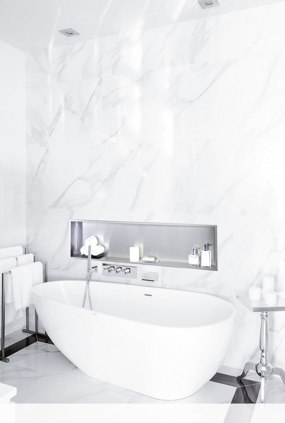 Alba wall niche, 12 × 48 in, brushed stainless steel, in a white marble wall above a tub and its fixtures