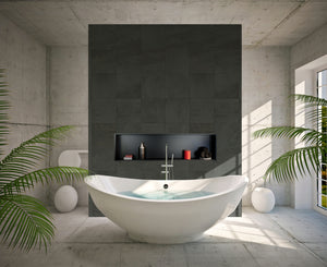 Alba wall niche, 12 × 48 in, matte black, in a dark tile wall behind an oval tub surrounded by plants