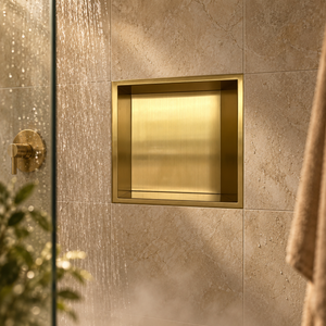 Ally wall niche, 12 × 12 in, gold PVD, recessed in a shower wall, empty