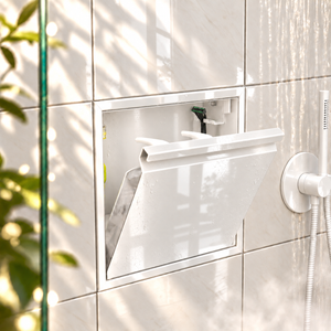 Door niche, 12 × 12 in, glossy white, tilt-down door open: toiletries stored inside