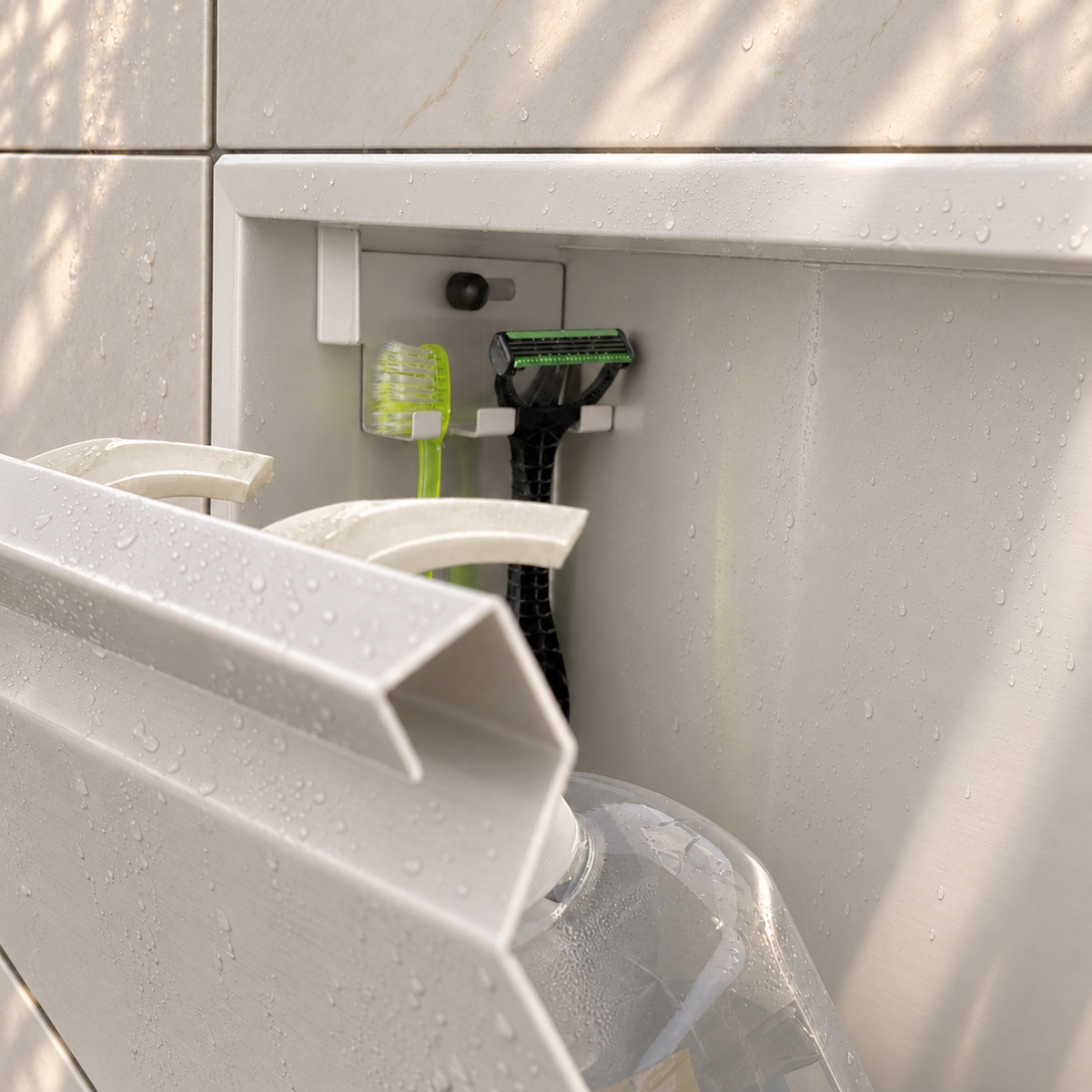 Close-up of the inside of the door niche, 12 × 24 in door, matte white: hooks holding a razor, a toothbrush and a bottle