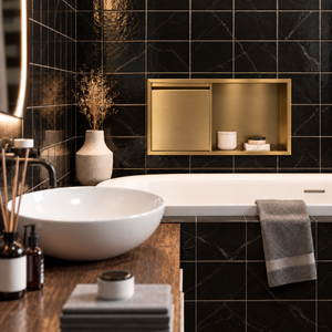 Bathroom with a door niche, 12 × 24 in, gold PVD, recessed above a bathtub, white vessel sink in the foreground
