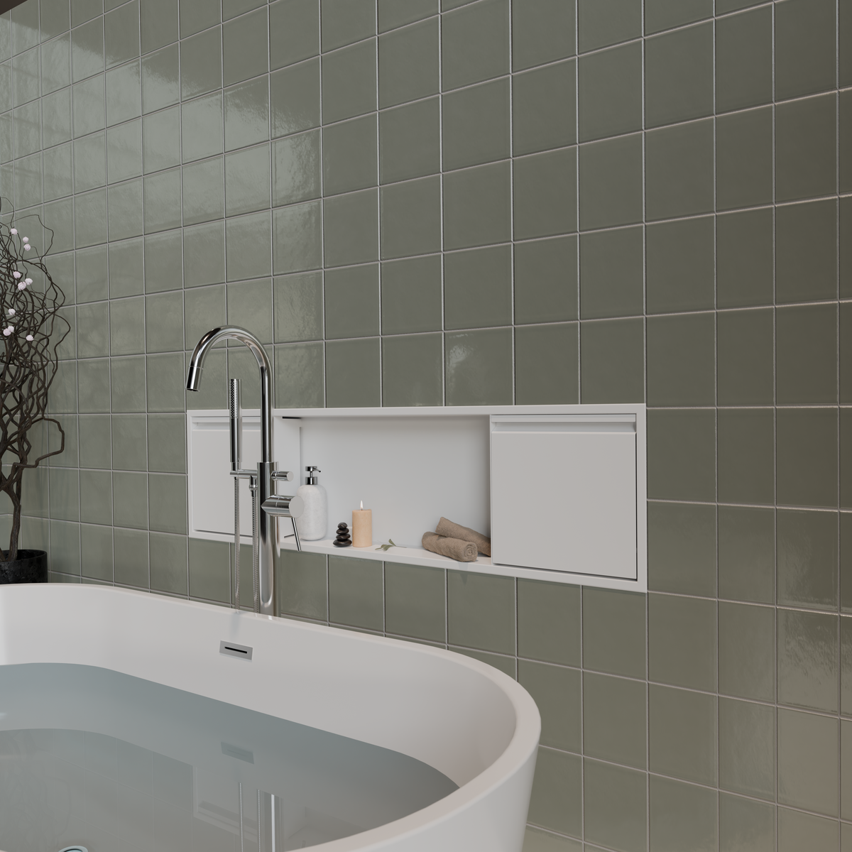 Door niche, 12 × 48 in, matte white, in a gray-green tiled wall above a freestanding tub, candle and towels inside