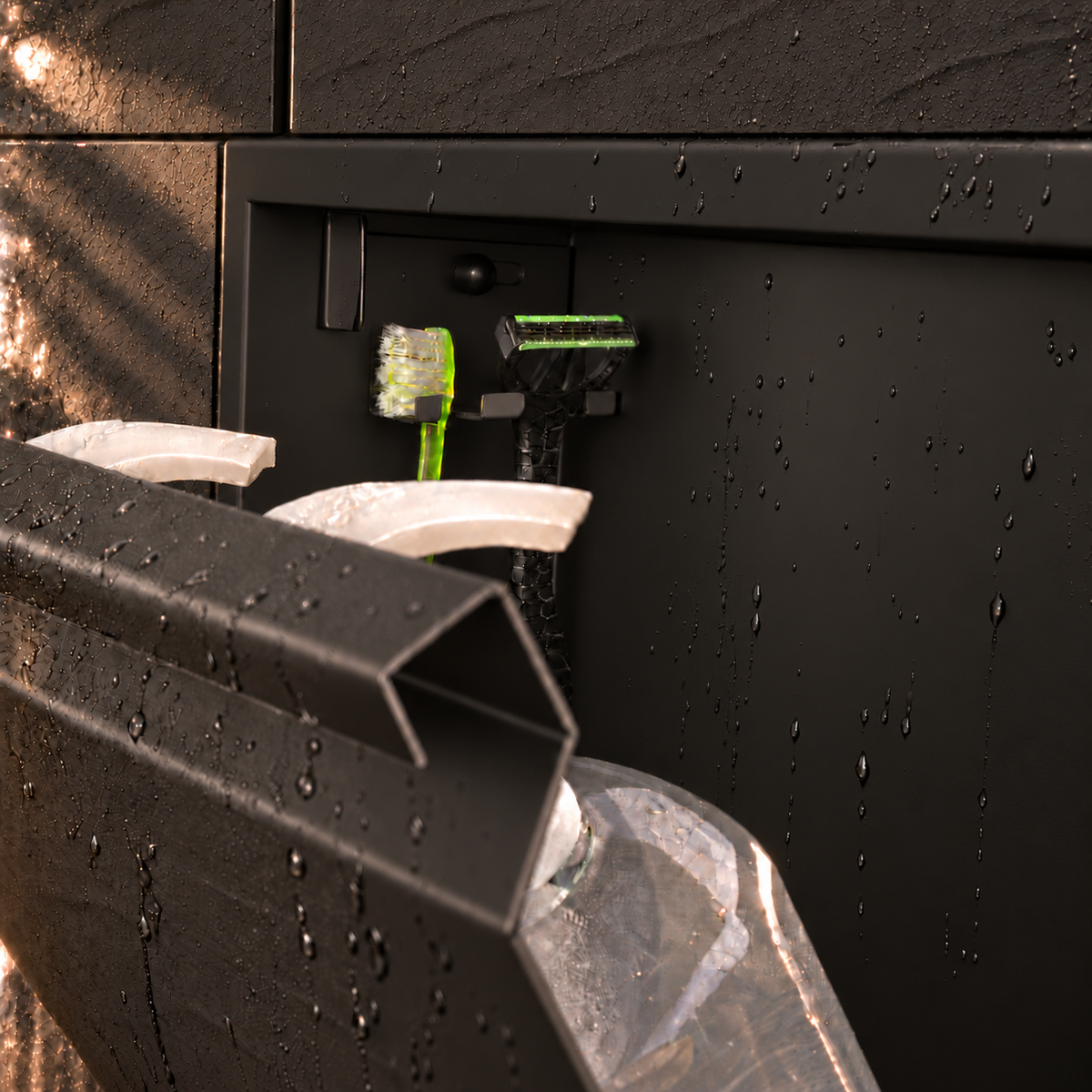 Close-up of the inside of the door niche, 12 × 48 in door, matte black: hooks holding a razor, a toothbrush and a bottle