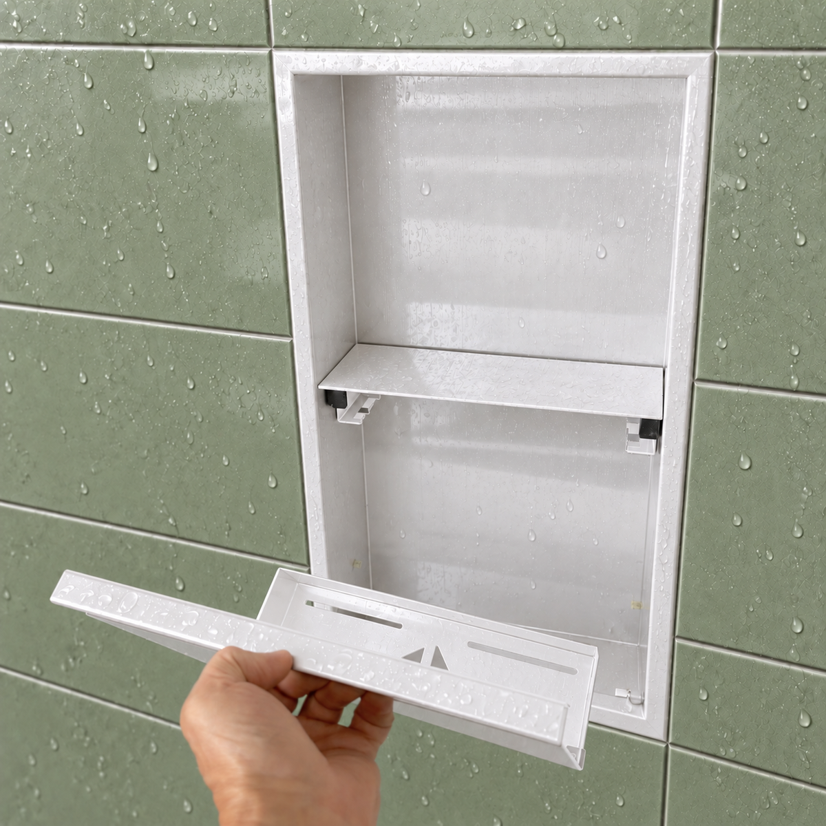A hand lifts the removable door off the door niche, 24 × 12 in, glossy white