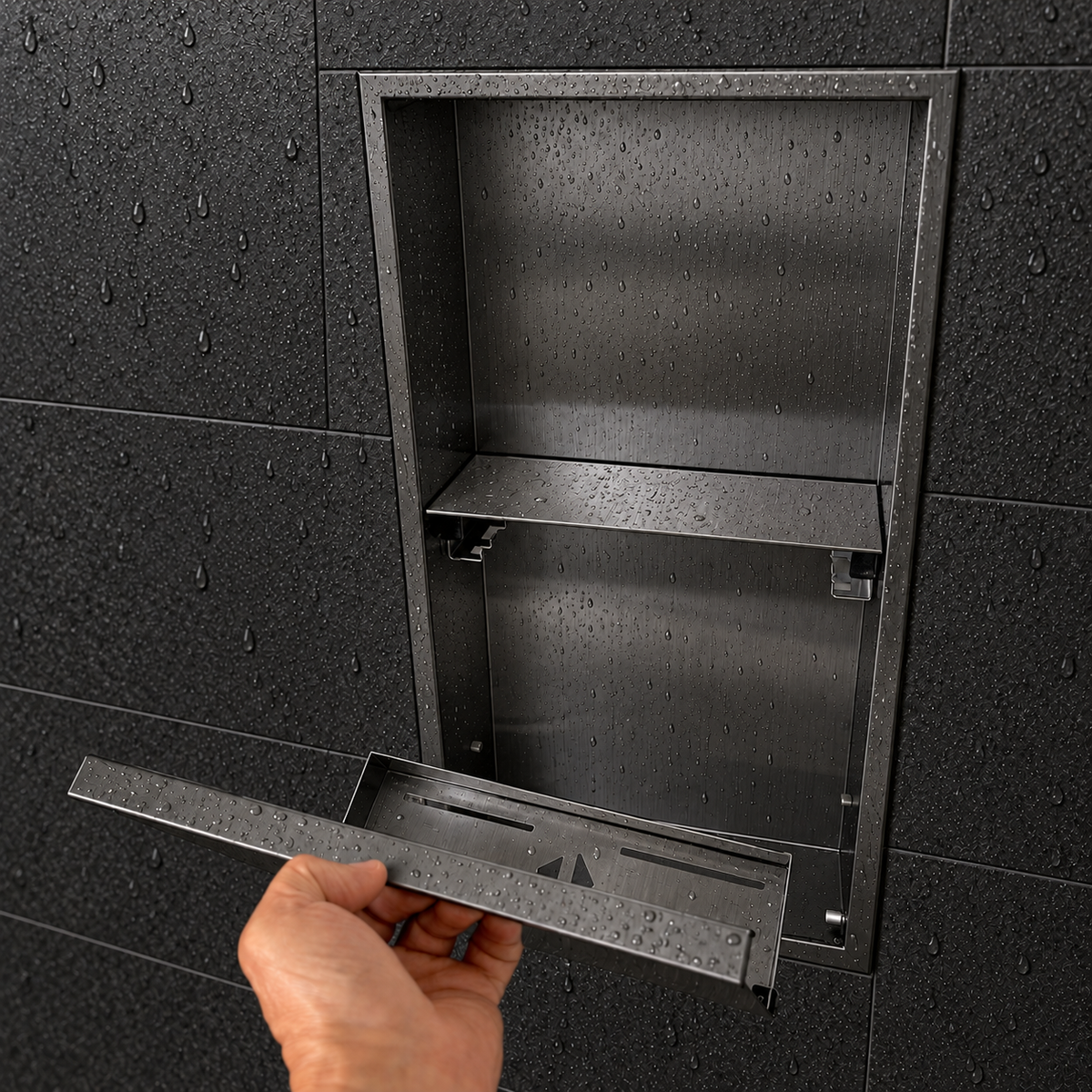 A hand lifts the removable door off the door niche, 24 × 12 in, black PVD