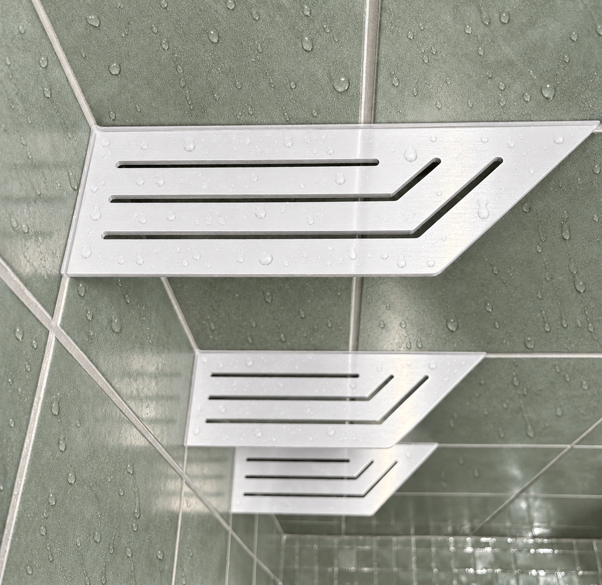 Corner shelf, 4 × 12 in, glossy white, close view, with the two smaller shelves below, in a tiled shower