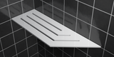 Corner shelf, 4 × 12 in, glossy white, mounted in the corner of a tiled wall