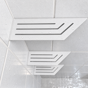 Corner shelf, 4 × 12 in, matte white, close view, with the two smaller shelves below, in a tiled shower