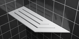 Corner shelf, 4 × 12 in, matte white, mounted in the corner of a tiled wall