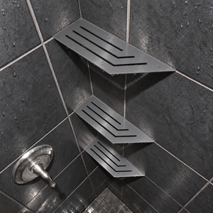Corner shelf, 4 × 12 in, matte gray, in the corner of a tiled shower, two smaller shelves below