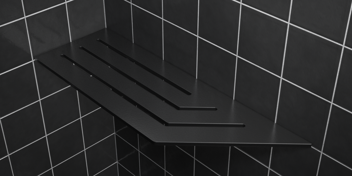 Corner shelf, 4 × 12 in, matte black, mounted in the corner of a tiled wall