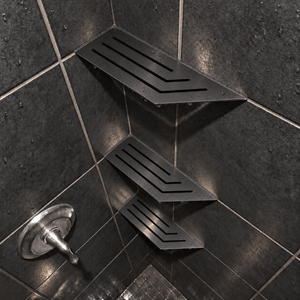 Corner shelf, 4 × 12 in, black PVD, in the corner of a tiled shower, two smaller shelves below