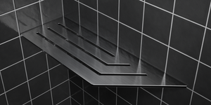 Corner shelf, 4 × 12 in, black PVD, mounted in the corner of a tiled wall