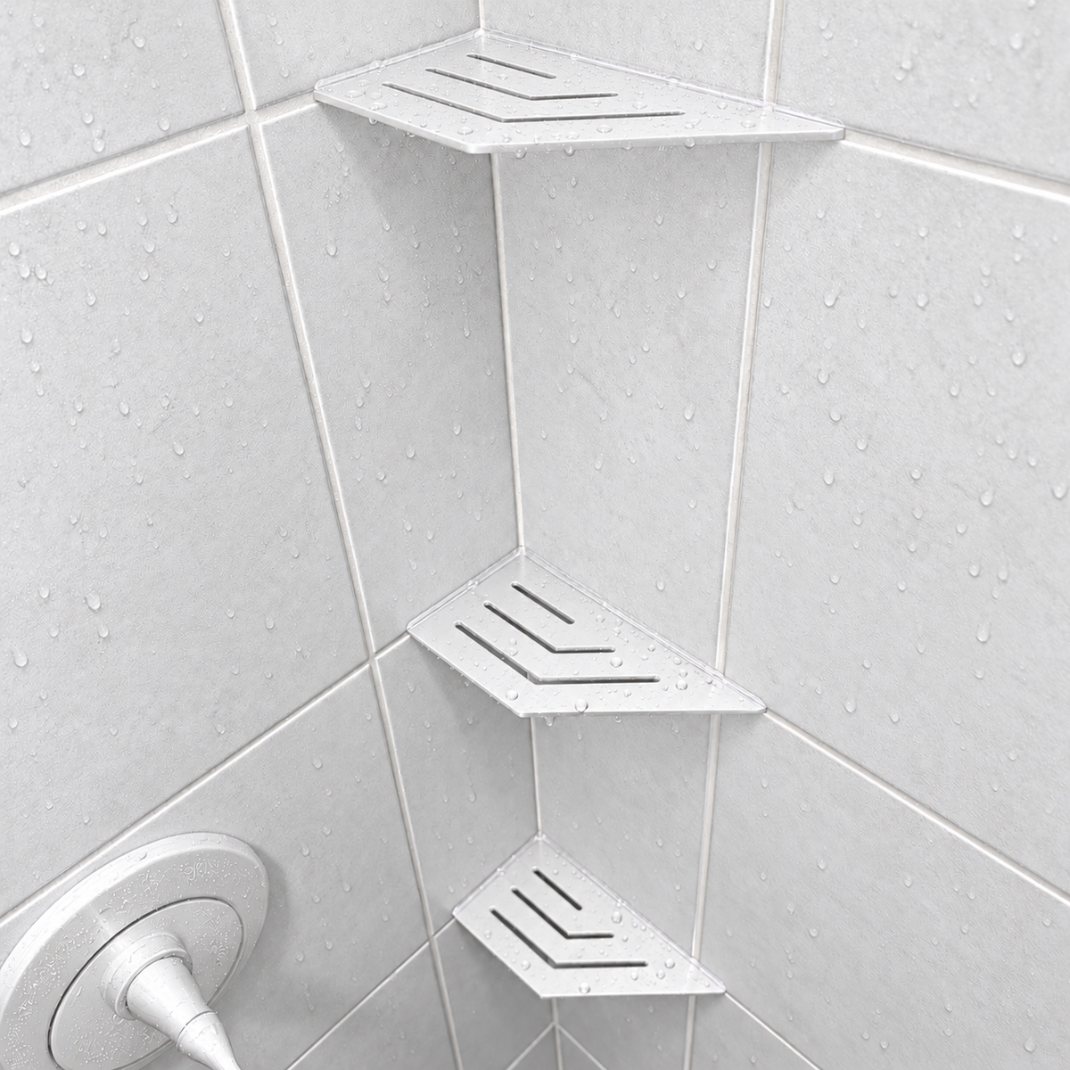 Corner shelf, 4 × 8 in, matte white, in the corner of a tiled shower, two smaller shelves below