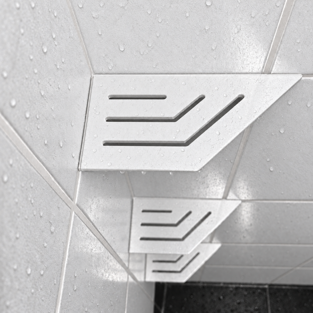 Corner shelf, 4 × 8 in, matte white, close view, with the two lower shelves, in a tiled shower
