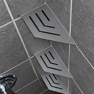 Corner shelf, 4 × 8 in, matte gray, in the corner of a tiled shower, two smaller shelves below