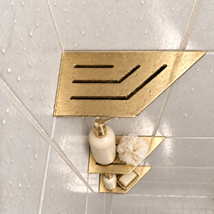 Corner shelf, 4 × 8 in, gold PVD, bottle and shower puff on the lower shelves, in a tiled shower